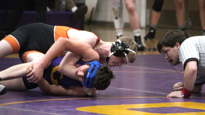 Quincy's Darren Craig turns his Concord opponent on the way to a pin fall win Wednesday