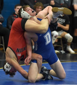 Freshman Kole Katschor of Dundee battled with D4 state champion Coy Perry of Clinton winning the 135-pound match 2-1 Wednesday, January 19, 2022 at Ida High School.