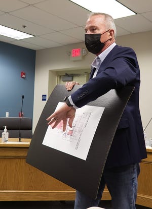 James Dubick, the property owner of the building at 331 E. Main Street in Kent explains plans for a proposed medical marijuana dispensary to attendees at a Tuesday planning commission meeting in Kent.