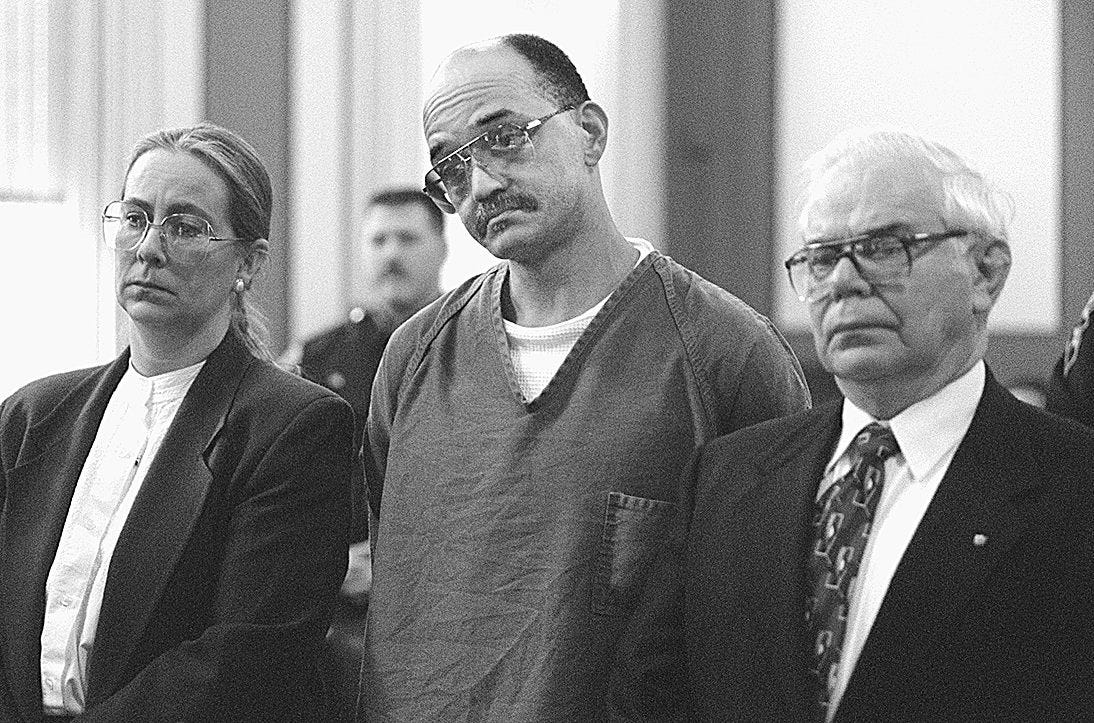 Elwood Jones, center, and his attorneys, Cathy Adams and Julius Sanks listen to Hamilton County Judge Ralph Winkler read the recommended death sentence to Mr. Jones for the Blue Ash motel murder of Rhoda Nathan on January 9, 1997.