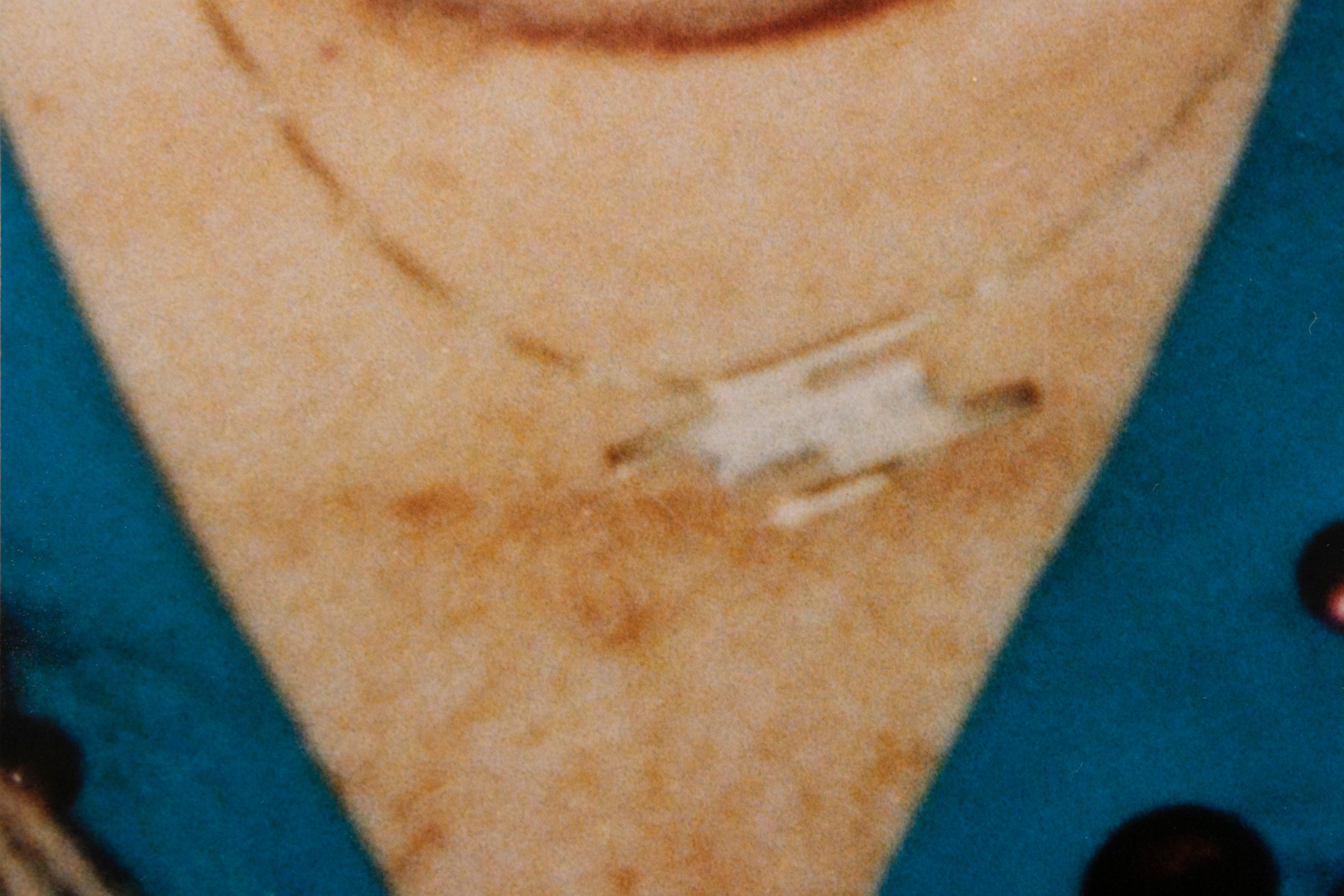 An evidence photo from police files that shows Rhoda Nathan wearing her necklace that was later a key piece of evidence in her case. The pendent was missing and later located in Elwood JonesÕs tool box. 