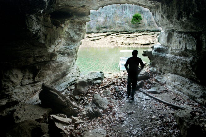 Tims Ford State Park ranger David England examines a cave that soon will become part of the park Jan. 3, 1997. A proposal would boost the Franklin County park near Winchester, Tenn., from about 400 acres to more than 2,000 and use a plan developed by the Tennessee Conservation League to protect the park's ecological features.