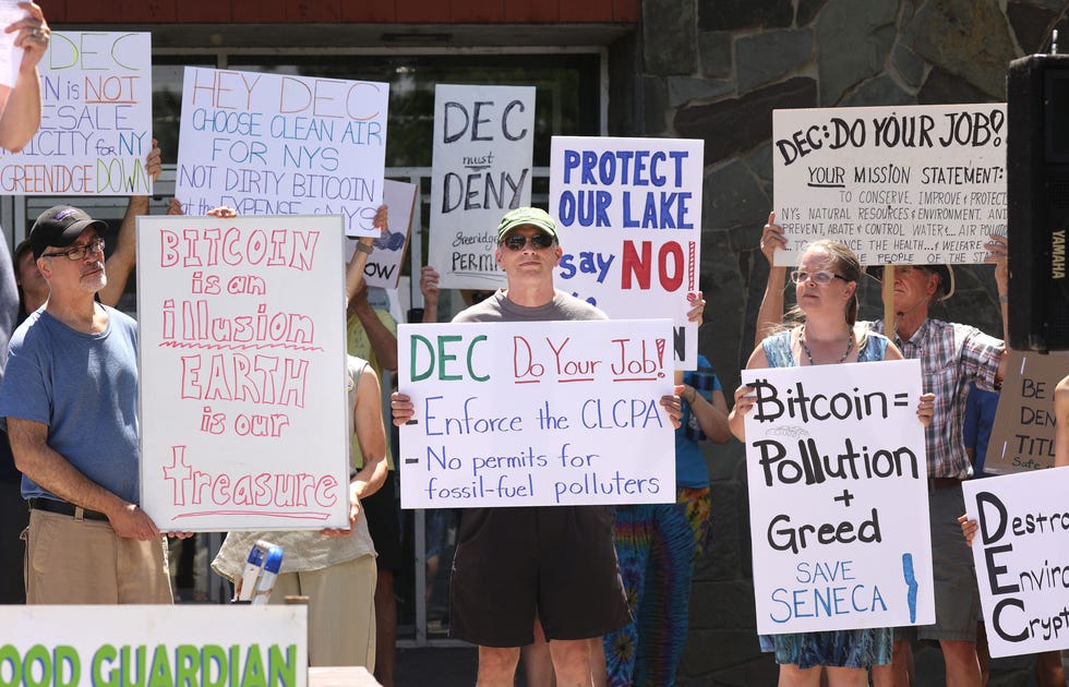 Members of the Seneca Lake Guardian, gather during  a rally at the DEC Region 8 office in Avon, urging the organization to reject Greenridge's Title V permit renewal. The group says Greenridges's Bitcoin Mining operations is having a negative impact on Seneca Lake water and the surrounding community. 