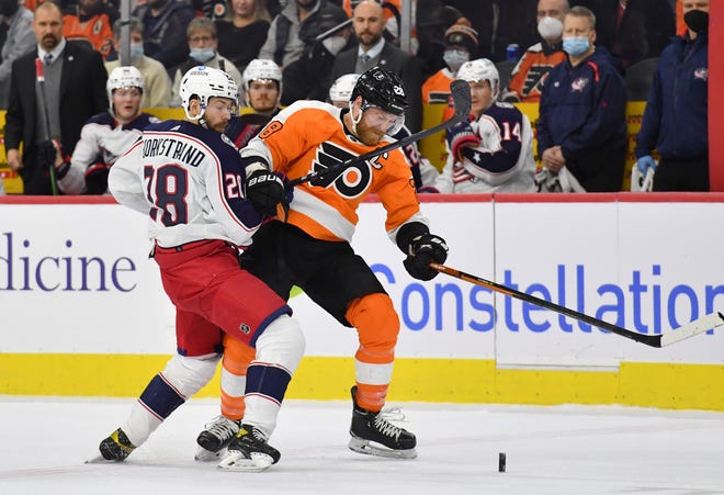 Jan 20, 2022; Philadelphia, Pennsylvania, USA; Columbus Blue Jackets right wing Oliver Bjorkstrand (28) and Philadelphia Flyers center Claude Giroux (28) battle for the puck during the first period at Wells Fargo Center. Mandatory Credit: Eric Hartline-USA TODAY Sports