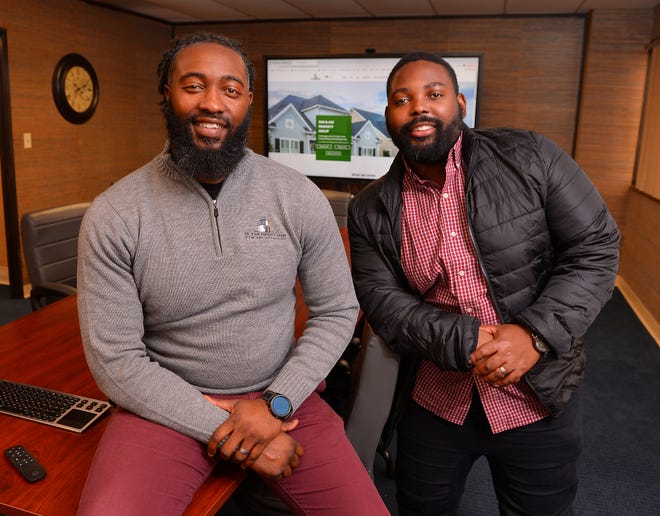 Ceej Jefferson, left, and Terrance Hawes, right, have opened their new venture, Oak & Ave Property Group. The business partners in the Oak & Ave Property Group office located at 145 N. Church Street in Spartanburg, Friday morning, January 20, 2022. 