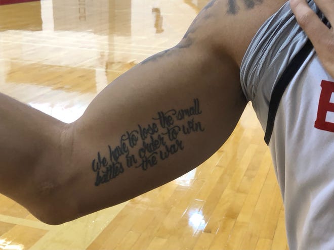 Bradley University senior forward Ja'Shon Henry has a tattoo with the words "We have to lose the small battles in order to win the war" to remind him of his late father's battle with cancer and how he dealt with adversity.