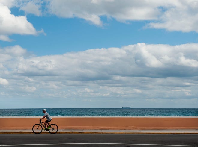 A cyclist headed north on South Ocean Boulevard near Midtown Beach in January.