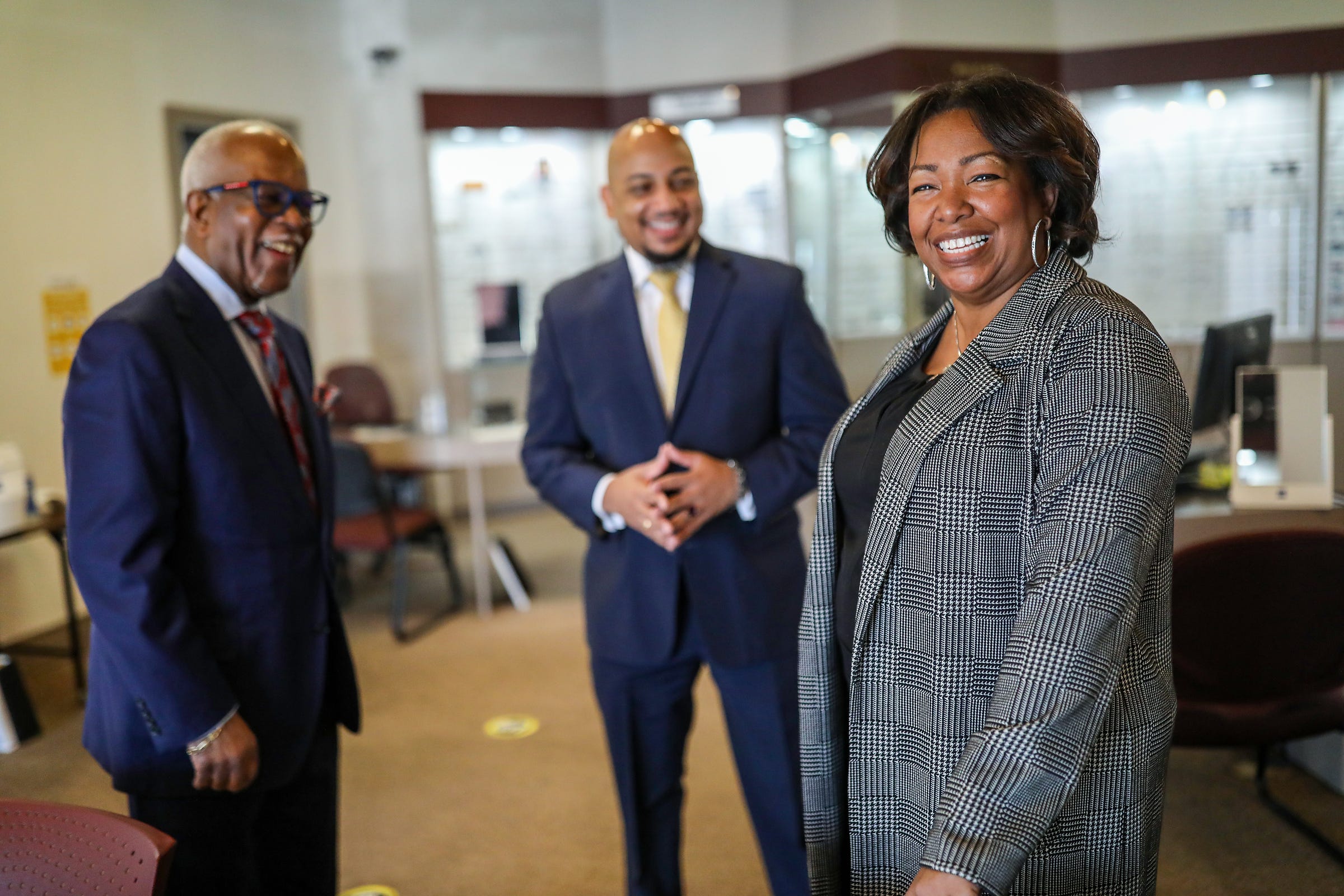 Jeanette King, Executive Director at Heritage Optical meets with the CEO of the National Business League INC. Ken Harris, center,  and the owner of Heritage Optical George P. Barnes Jr. at their location in Northwest Detroit on Friday, Jan. 21, 2022. The Heritage Group is a national brand that is in all 50 states.