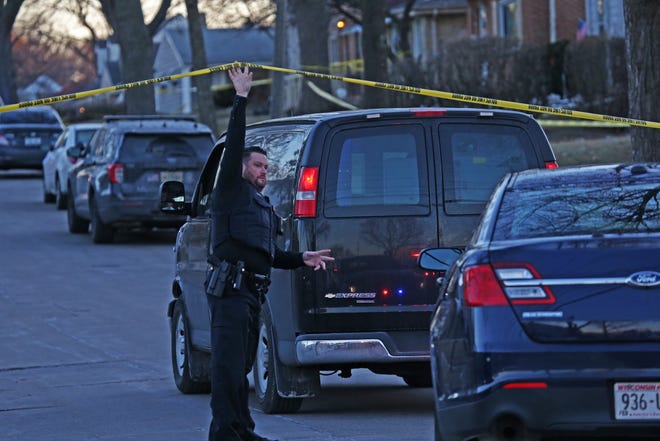 Milwaukee Police officer let official vehicles into the area of  3900 block  N. 75th street at a double homicide on Friday, Jan  21,2022.