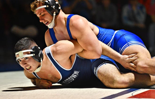 Dallastown's Ben Usow, left, and Spring Grove's Logan Herbst wrestle in a 215-pound bout on Jan. 20. Both Dallastown and Spring Grove will compete in the District 3 Class 3-A wrestling playoffs this week.