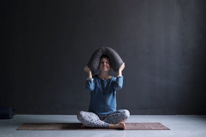 Girl frustrated doing yoga.