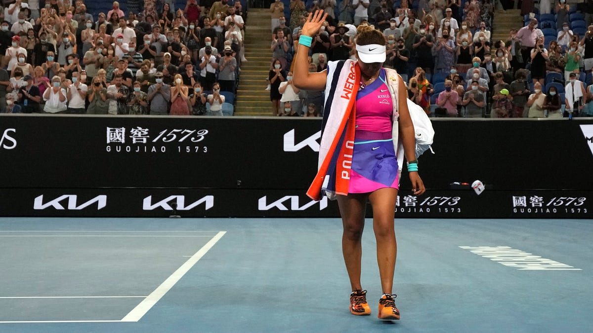 Naomi Osaka walks off the court after losing to Amanda Anisimova at the Australian Open.