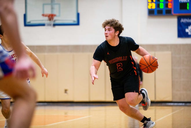 Fennville's Ben Peterson takes the ball up the court against Saugatuck Friday, Jan. 21, 2022, at Saugatuck High School. 