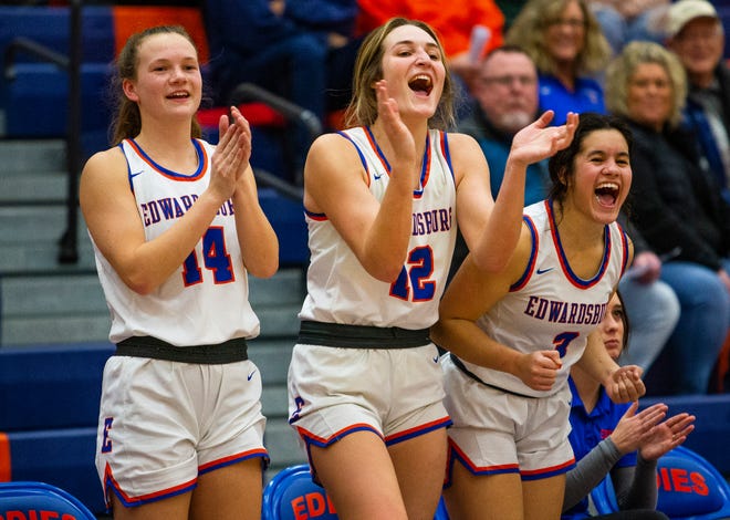 Edwardsburg's Katie Schaible, Macey Laubach and Ella Castelucci celebrate on the bench during the Edwardsburg vs. Niles girls basketball game Friday, Jan. 21, 2022 at Edwardsburg High School. 