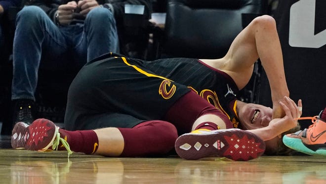 Cavaliers forward Lauri Markkanen grimaces in pain after injuring his ankle in Saturday night's game against the Oklahoma City Thunder. No timetable has been set for Markkanen's return but coach J.B. Bickerstaff said Markkanen will mist at least a few games. [Tony Dejak/Associated Press]