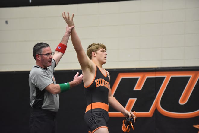 Hudson senior Cameron Kimble has his hand raised after winning his pinfall win over Jonesville's Isaac Shively in the quarterfinals of the Super 16 on Saturday, Jan. 22. The quarterfinal win was Kimble's 100th of his career as he went on to win the 189 weight class Saturday.