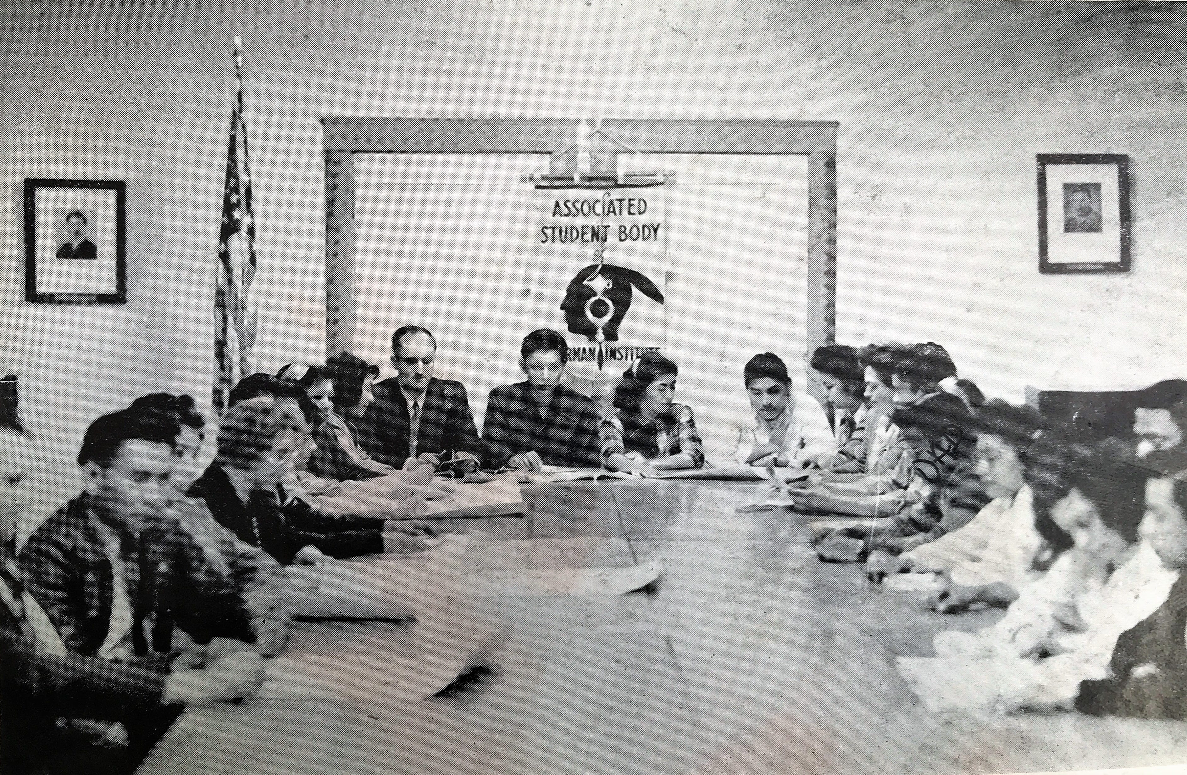 The 1948 yearbook for Sherman Indian High School shows April Carmelo's father, Daniel Carmelo (Dad written over face), in a photo titled "Associated Student Body Cabinet in Session."