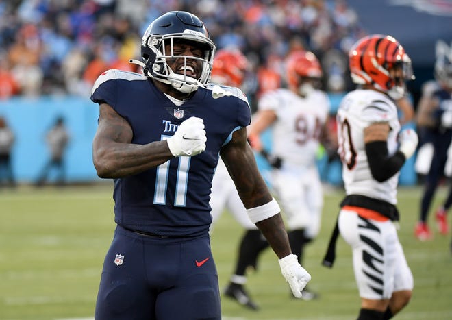 Tennessee Titans wide receiver A.J. Brown (11) celebrates after a catch during the first half of an AFC Divisional playoff football game against the Cincinnati Bengals at Nissan Stadium.