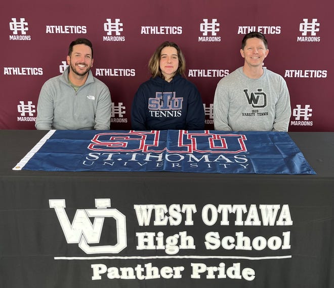 Jeanne Hecquet with coaches Adam Ford and Pete Schwallier.