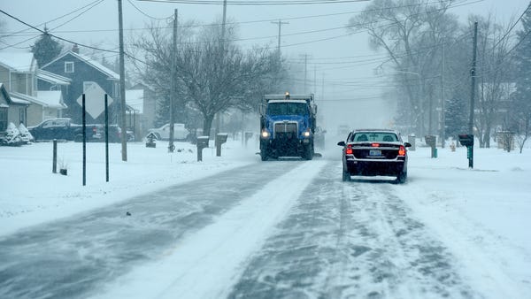 A Monroe County Road Commission snow plow salting 