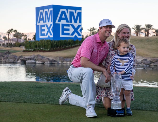 2022 champion Hudson Swafford poses with his wife, Katherine, and their 3-year-old son James with his new trophy after winning The American Express at PGA West in La Quinta, Calif., Sunday, Jan. 23, 2022. 
