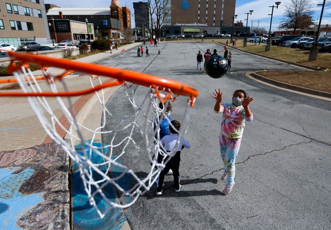 Students in the Discovery Center's Emergency Discovery School program play basketball during a recess on Monday, Jan. 24, 2022. When Springfield Public Schools canceled school due to rising COVID-19 numbers, the Discovery Center opened up a limited number of spots for free childcare.