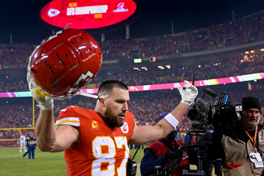Kansas City Chiefs tight end Travis Kelce celebrates after beating the Buffalo Bills in overtime in an NFL divisional playoff football game, Sunday, Jan. 23, 2022 in Kansas City, Mo.