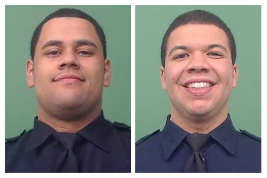 This photo combo of images provided by the New York City Police Department shows NYPD Officers Wilbert Mora, left, and Jason Rivera. The two officers were shot while answering a call about an argument between a woman and her adult son in the Harlem neighborhood of New York, Friday, Jan. 21, 2022.