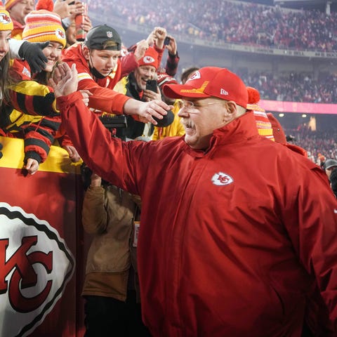 Chiefs coach Andy Reid celebrates with fans after 