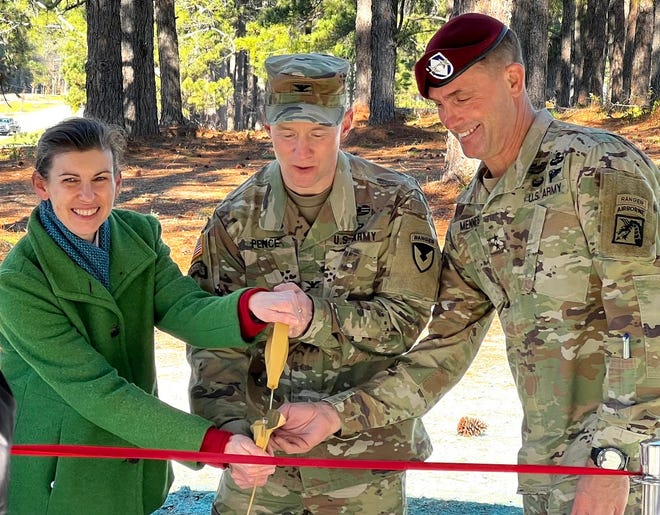 Monica Stephenson, director of Fort Bragg's Directorate of Public Works; Col. Scott Pence, Fort Bragg garrison commander; and Maj. Gen. Brian Mennes, 18th Airborne Corps deputy commanding general, cut the ribbon at the opening of  Fort Bragg’s newest park, Liberty Park on Jan. 19, 2022.