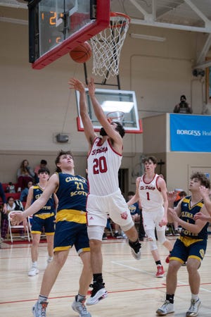 St. Philip's Chris Adam goes to the basket during first half action against Climax-Scotts at St. Philip High School on Monday, January 24, 2022.