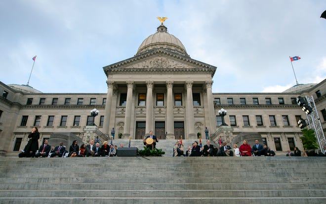 Gov. Tate Reeves, center, delivers the State of the State before a joint session of the Mississippi Legislature at the south of the Capitol in Jackson, Miss., Tuesday, Jan. 25, 2022.