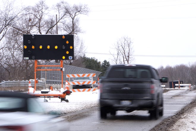 Vehicles cross the Eight Mile Road bridge near Novi Road on Jan. 25, 2022.  Two of four lanes have been closed on the bridge for over a year with no hint of construction. A $1.49 million construction project on the bridge is scheduled to start in spring 2024.