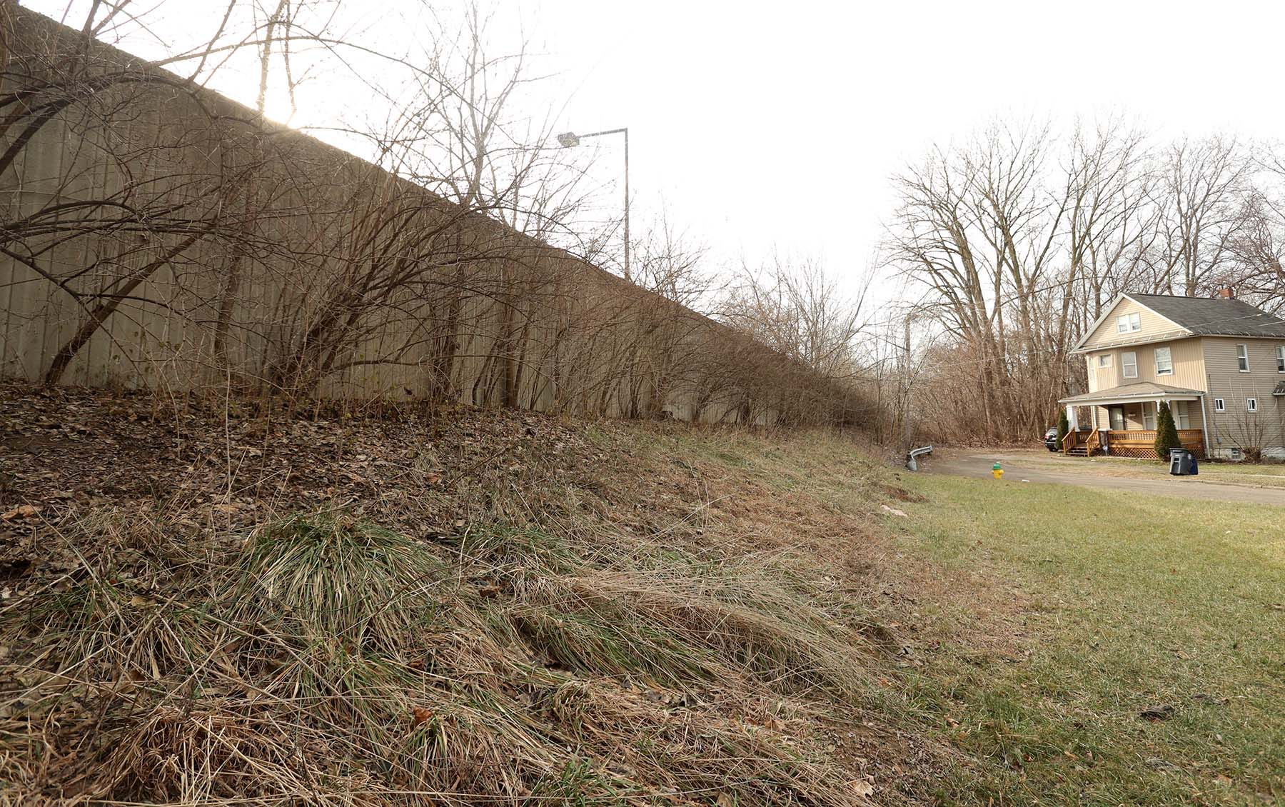 A wall separates the Akron Innerbelt from what remains of Douglas Street.