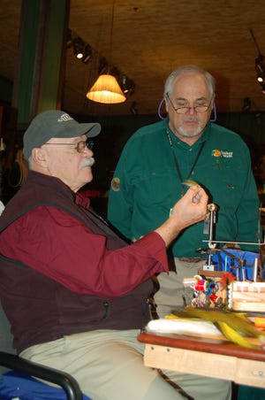 Bob Clouser instructs on how to tie his famous Clouser Minnow.