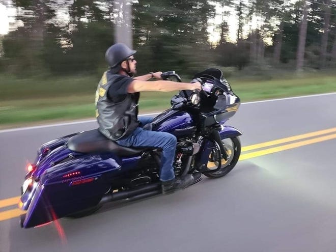 Joe Ludwick with the Southern Saints rides a motorcycle in October.