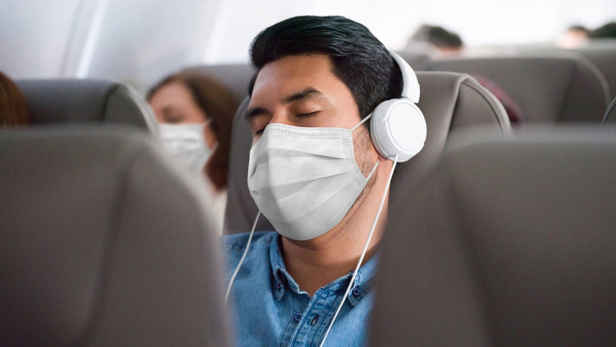 A comfortable, breathable mask and noise-canceling headphones can make a long-haul flight more bearable. So can bringing your own pillow and blanket.