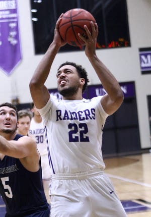 Mount Union's Christian Parker puts up a shot against John Carroll during a game in January.