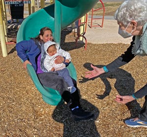Lakeland resident Trudy Rankin, right, provides encouragement as an Afghan woman takes her daughter down a slide for the first time at a playground in Las Cruces, New Mexico. Rankin and her husband, Larry Rankin, spent time with refugee families from Afghanistan while volunteering with a church in Las Cruces.