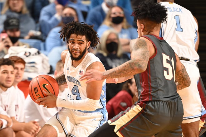 North Carolina guard RJ Davis, left, looks for room against Boston College guard Brevin Galloway on Wednesday night at the Smith Center.