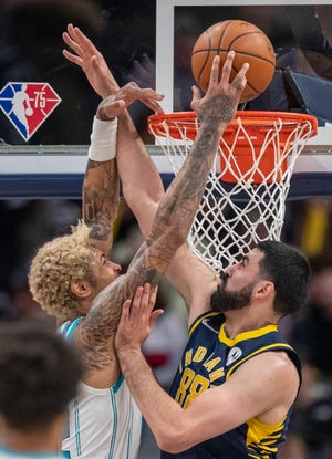 Charlotte Hornets guard Kelly Oubre Jr. (12) ties up with Indiana Pacers center Goga Bitadze (88) under the basket during Charlotte Hornets vs. Indiana Pacers at Gainbridge Fieldhouse, Indianapolis, Wednesday, Jan. 26, 2022. 