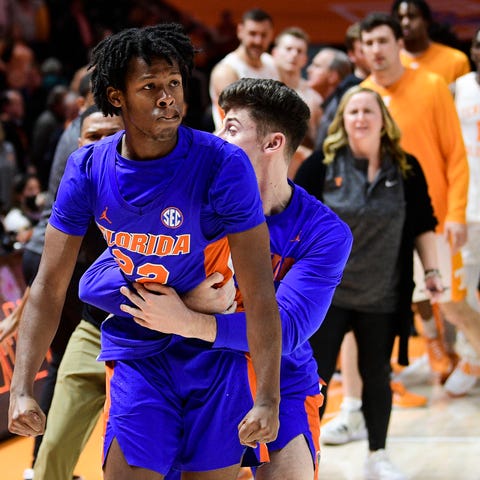 Florida guard Tyree Appleby (22) is removed from a