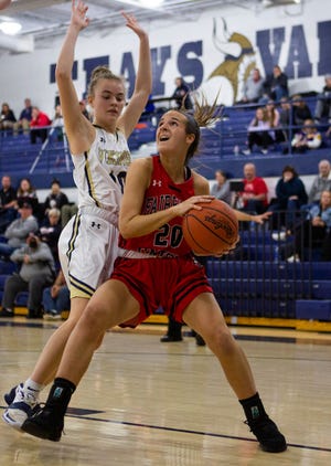 Fairfield Union's Hannah Rauch (20) looks for a shot past a  the Teays Valley defender in girls varsity basketball action at Teays Valley High School in Asheville, Ohio on January 26, 2022.