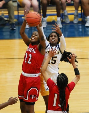 Manual's Daisha White (22) controls a rebound against Franklin County's Jazmin Chambers (15) during the Girls LIT tournament at the Valley High School gym in Louisville, Ky. on Jan. 26, 2022.