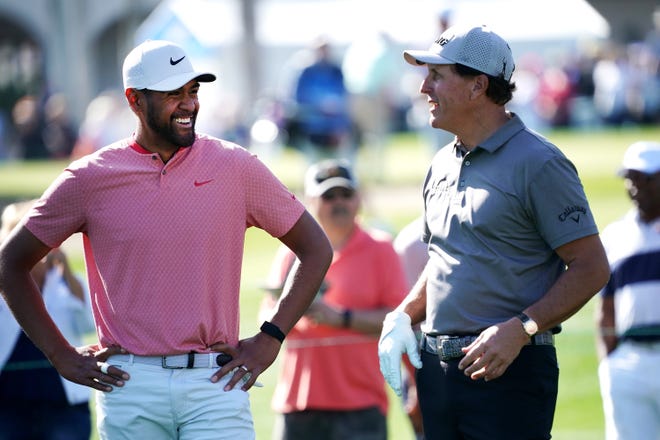 PGA Tour golfer Tony Finau (left), an American Express golf ambassador, shares a smile with World Golf Hall of Famer Phil Mickelson.