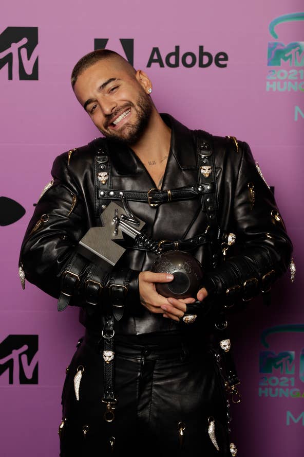Maluma, born Juan Luis Londoño Arias, has become one of the most successful Latin artists of his generation — and he hasn't let anything stop him from putting in the work. <br /> <br /> In a September 2019 interview with PopSugar, Maluma said he always dreamed of making music. "My career was not made overnight. It's a reflection of what's happening nowadays with us Latinx in music, plus all the work and sacrifice I've put in throughout many years. Latinx are trendy now," Maluma said. "What's happening with Latin American music is huge, and as an artist, I have to take advantage of that opportunity and try to sneak in there and get my music heard. The doors have been opened for us, and now it's up to us if we close them or keep them open for the new generations of Latinx artists."