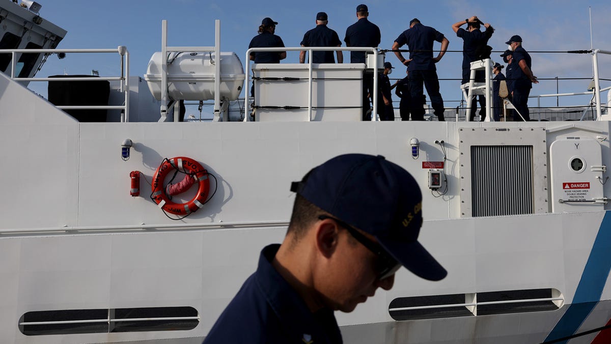 U.S. Coast Guard crew members work on a cutter at the Miami sector base on Jan. 26 in Florida.