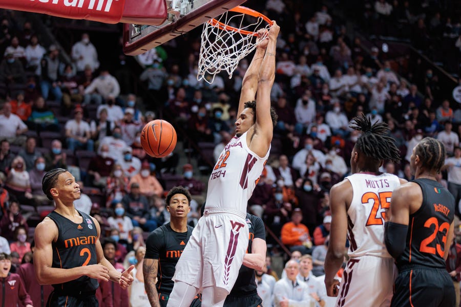 Jan. 26: Virginia Tech forward Keve Aluma (22) dunks the ball against Miami during the second half at Cassell Coliseum. Aluma scored 14 points for the Hokies, but the Hurricanes prevailed 78-75.