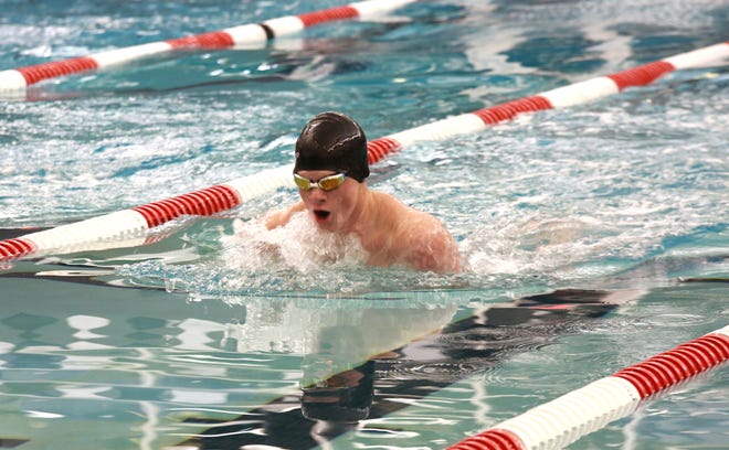 Coldwater's Drake Thornton battles his way to a win in the 100 yard Breaststroke on Thursday night versus Sturgis.