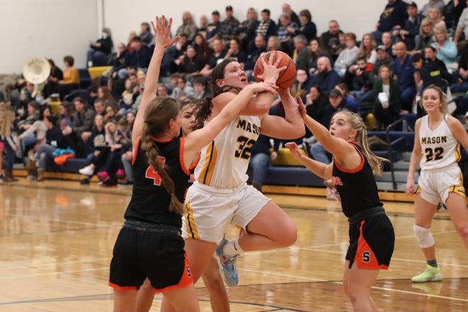 Erie Mason's Lizzie Liedel fights to the basket Thursday night against Summerfield. Liedel finished with 46 points, 19 rebounds and 6 steals to lead the Eagles to victory.